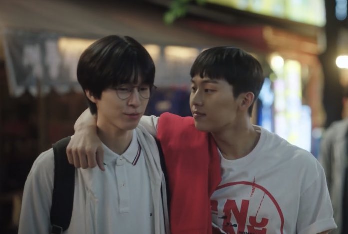 "Screenshot from Weak Hero Class 1 showing Hong Kyung as Oh Beom-seok with a genuine smile while looking at Choi Hyun-wook as Ahn Su-ho, capturing that moment of inner warmth the subscriber described." Source: Weak Hero Class 1, Wavve/Netflix. All rights reserved to the original creators.
