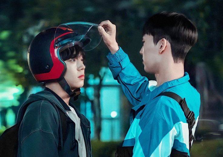 "Su-ho putting a helmet on Si-eun before their motorcycle ride - a protective gesture that perfectly captures his caring, 'hyung-like' nature toward his friends. Source: Weak Hero Class 1, Wavve/Netflix"