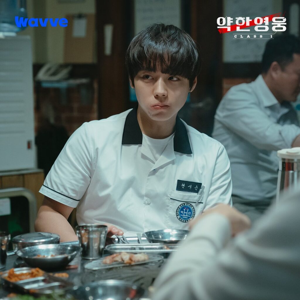 "Actor Park Ji-hoon as Yeon Si-eun making an adorable expression while eating in Weak Hero Class 1, showing a rare moment of Si-eun's softer, more childlike side beneath his usually serious demeanor. Source: Weak Hero Class 1, Wavve/Netflix"
Β© Weak Hero Class 1, Wavve/Netflix. Used under fair use for educational analysis and criticism. No copyright infringement intended.