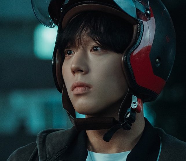 "Si-eun looking at Su-ho while wearing his helmet - a tender moment that shows their growing bond and Si-eun's trust in accepting Su-ho's protection. Source: Weak Hero Class 1, Wavve/Netflix"