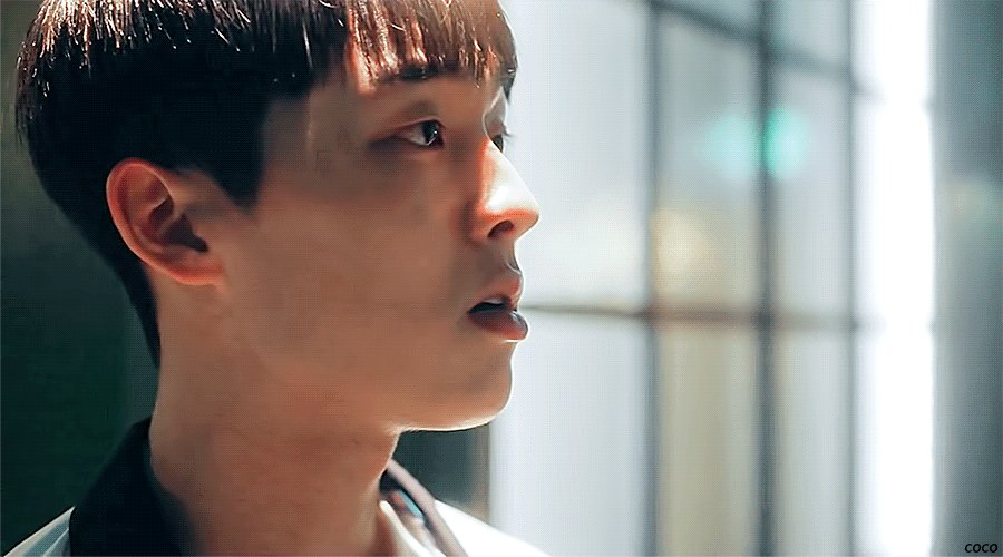"Screenshot from Weak Hero Class 1 showing Choi Hyun-wook as Ahn Su-ho with a pained expression after being verbally attacked, revealing his emotional vulnerability beneath his usual composed exterior."