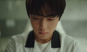 A close-up of Yeon Si-eun's eyes during his 'berserk' mode, showing uncontrollable rage that functions as a form of self-harming violence when his inner order is shattered.